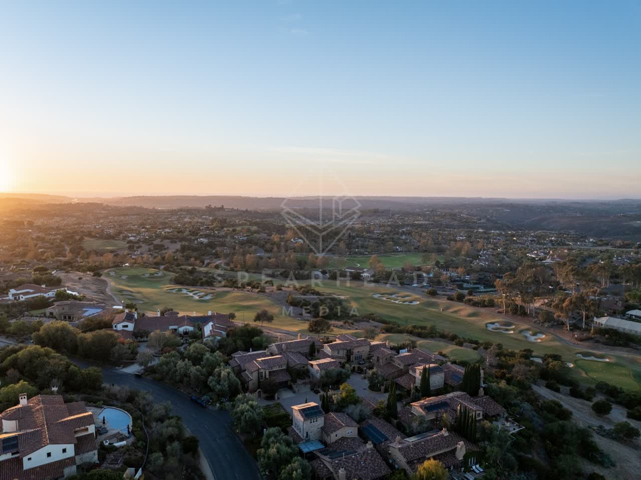 Aerial view of a residential street, homes and the buildings in Santaluz.
