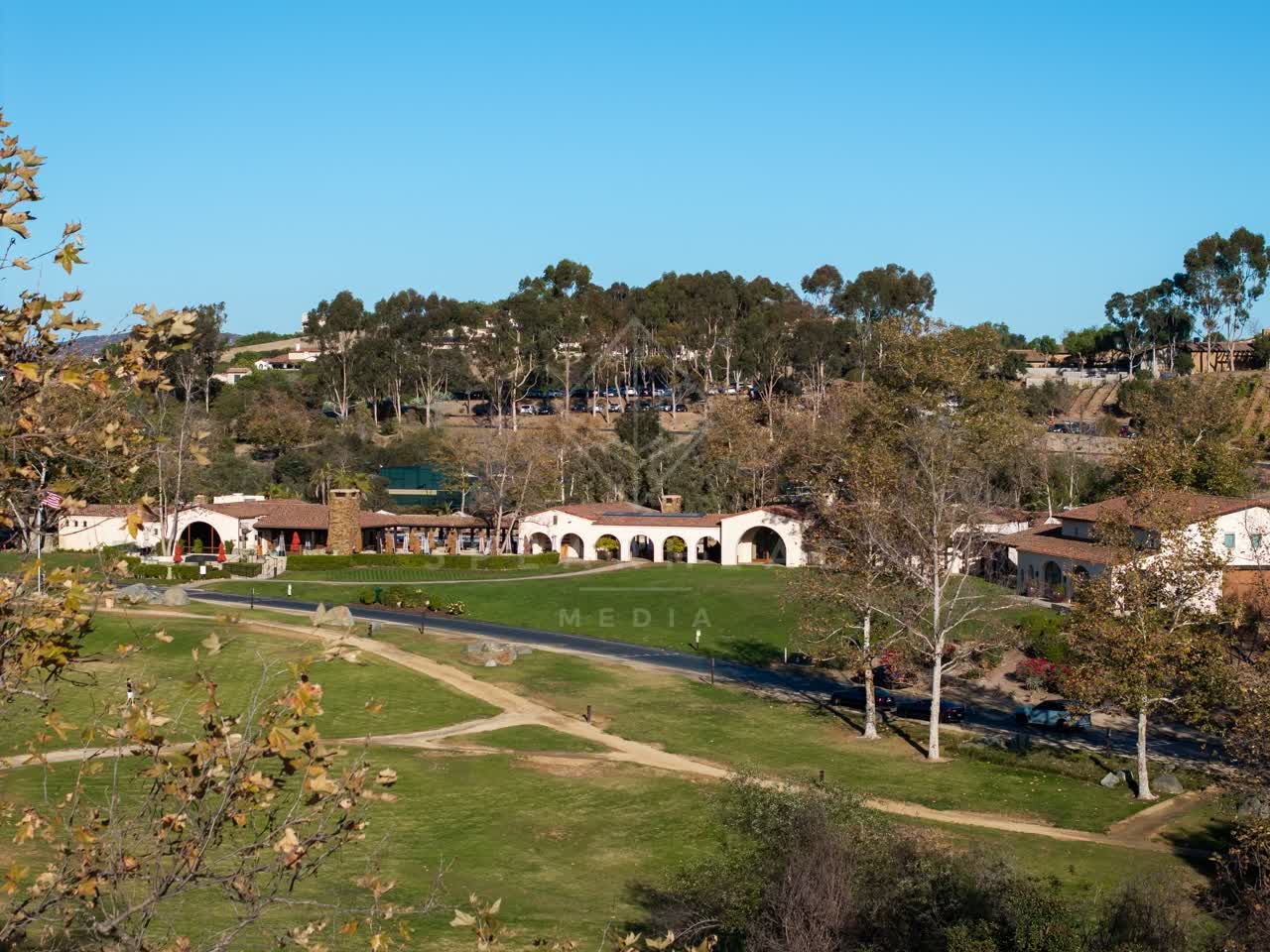 Elevated view of the country inland, the buildings and traffic in Santaluz.