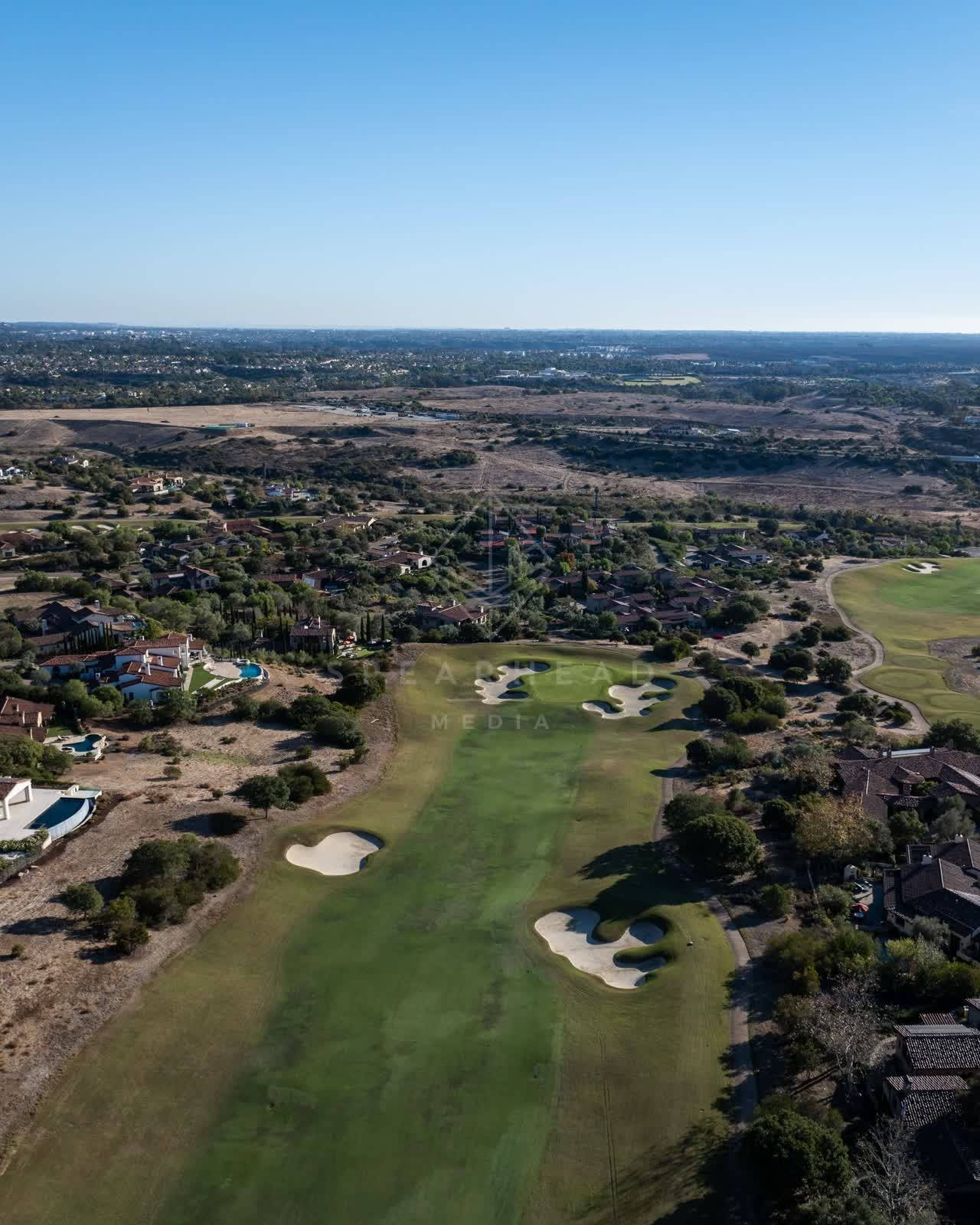 Aerial view of the country inland, homes and the buildings in Santaluz.
