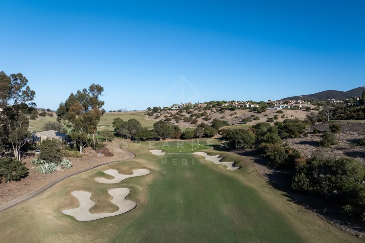 Low aerial view of the country inland, homes and open country in Santaluz.