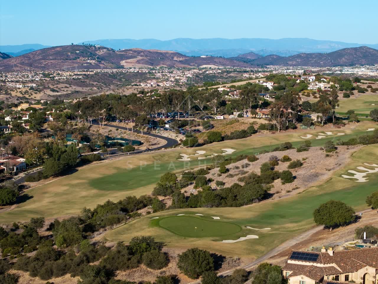 Aerial view of the country inland, homes and traffic in Santaluz.