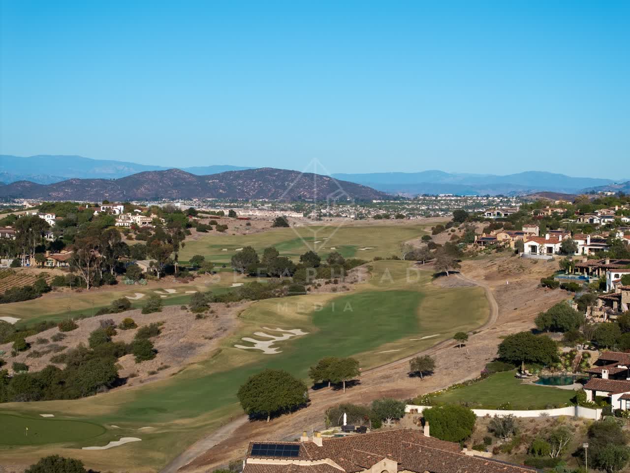 Aerial view of the country inland, homes and the buildings in Santaluz.