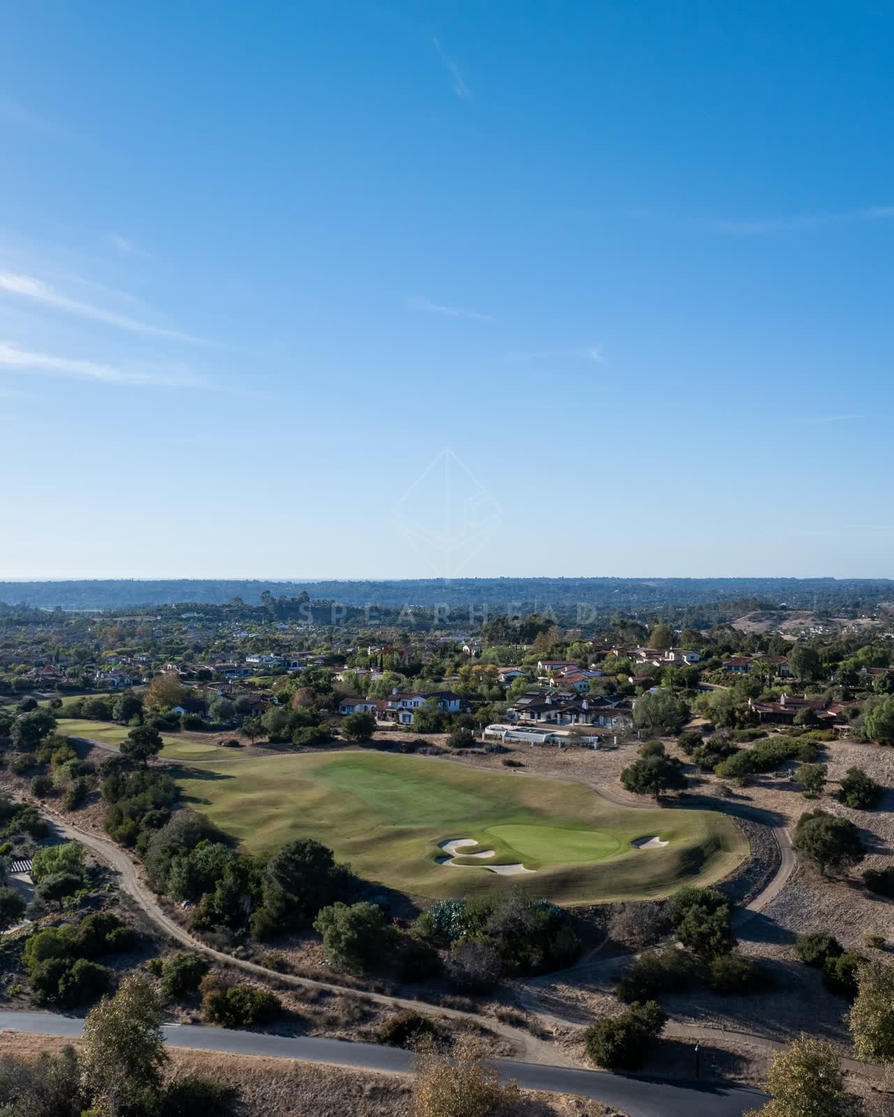Aerial view of the country inland, homes and open country in Santaluz.