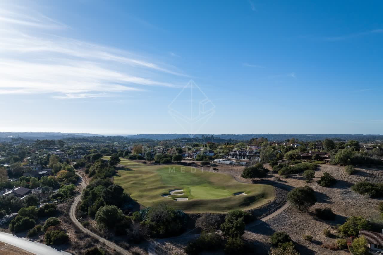 Aerial view of the country inland, homes and the buildings in Santaluz.