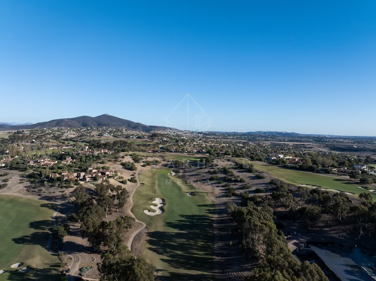 Aerial view of the country inland, homes and open country in Santaluz.