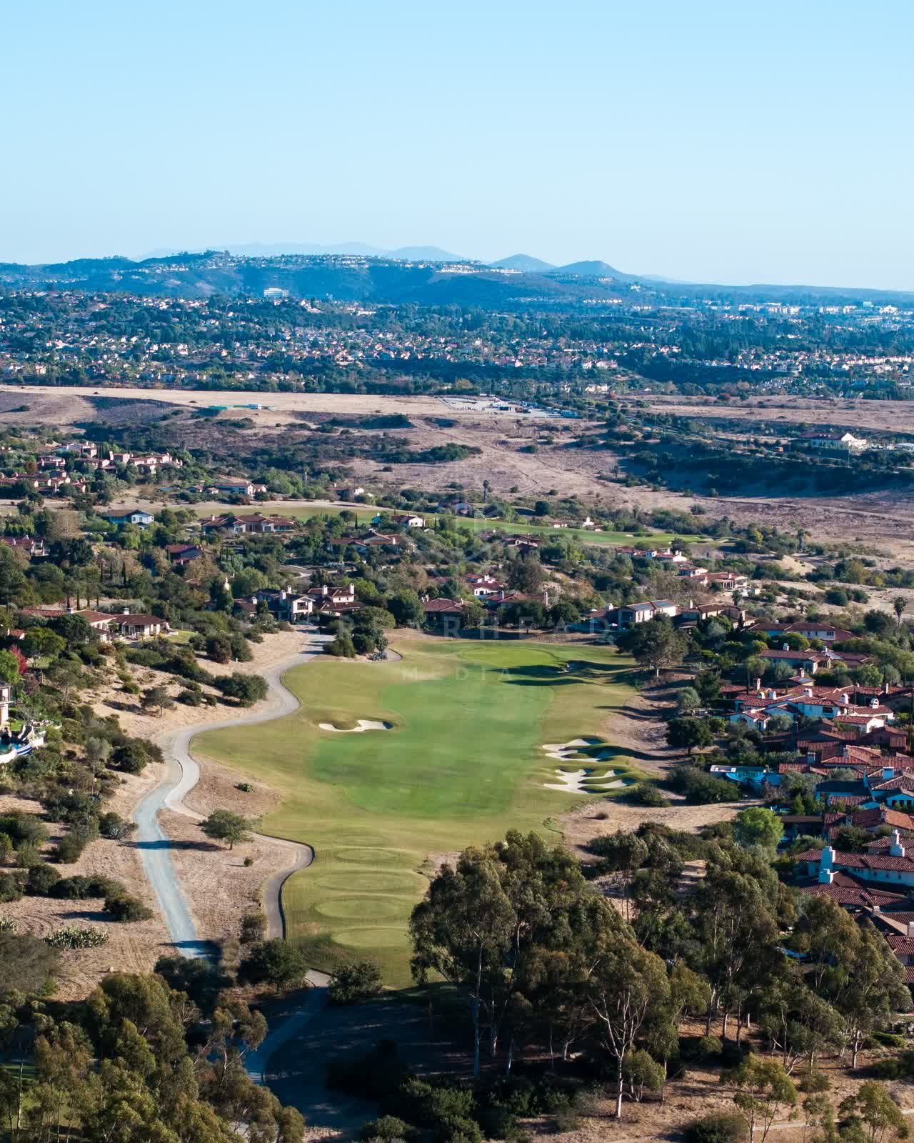 Aerial view of the country inland, homes and the buildings in Santaluz.