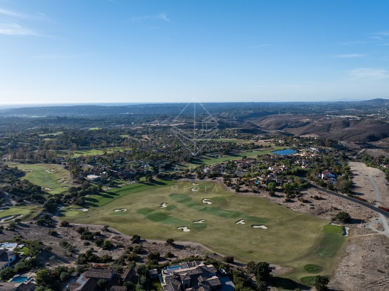 Aerial view of the country inland, homes and the buildings in Santaluz.