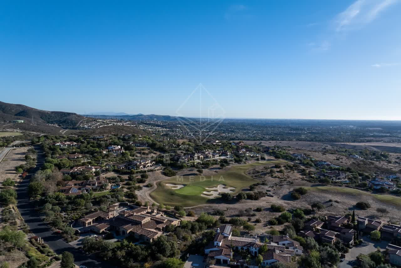 Aerial view of a residential street, homes and the buildings in Santaluz.