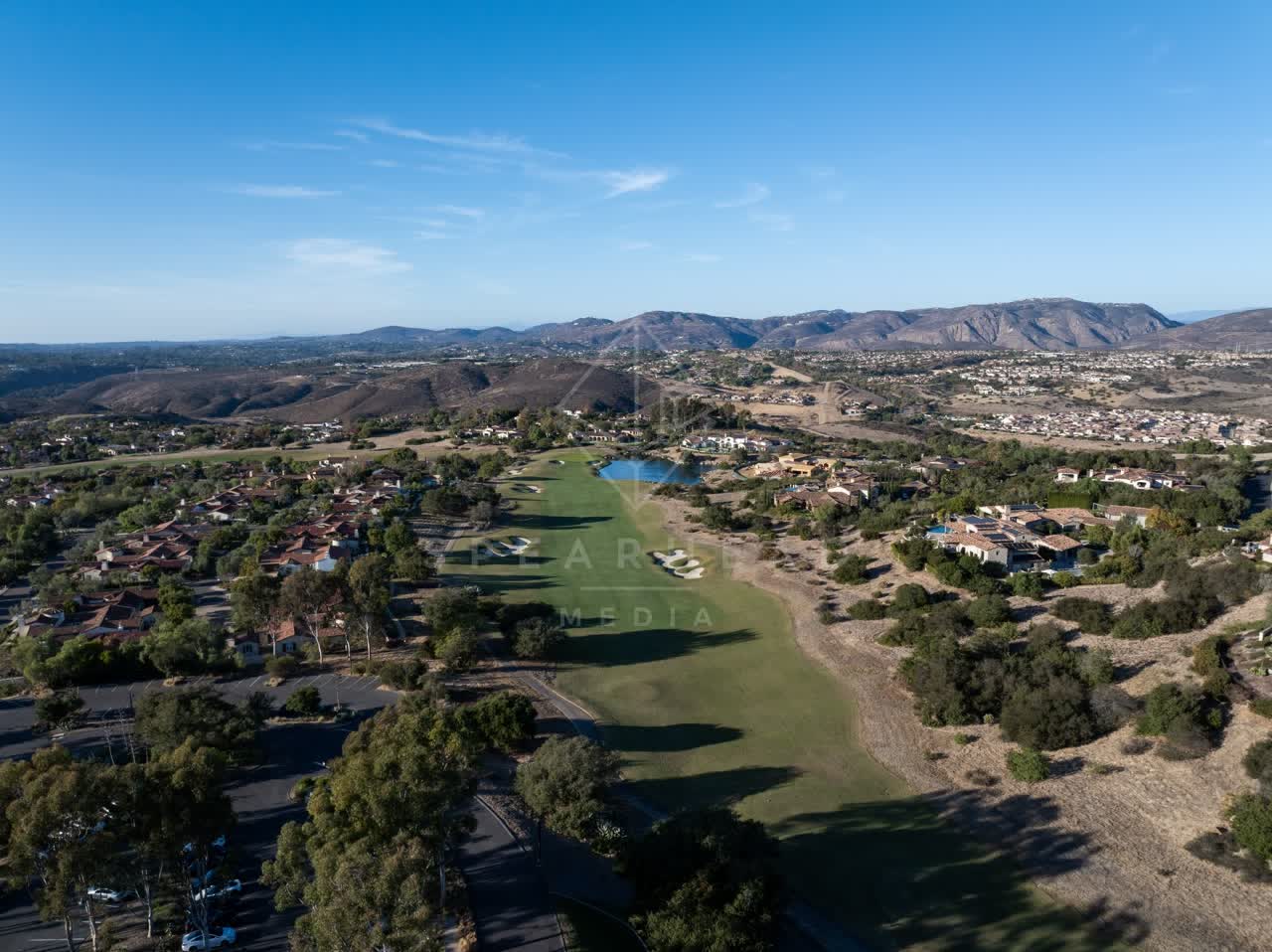 Aerial view of the country inland, homes and open country in Santaluz.