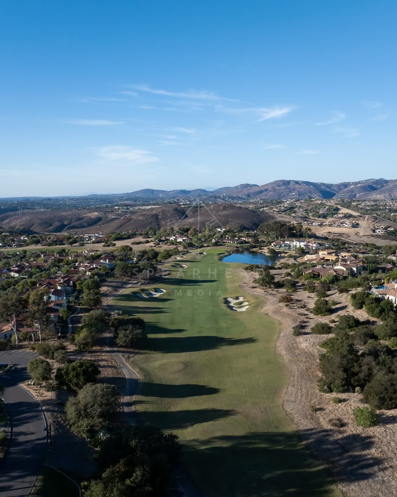 Aerial view of the country inland, homes and open country in Santaluz.