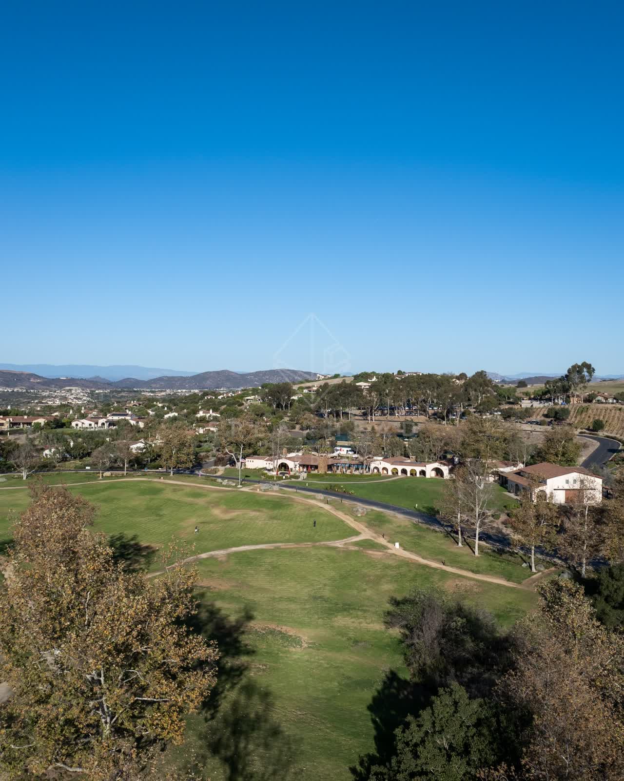 Aerial view of the country inland, homes and the buildings in Santaluz.