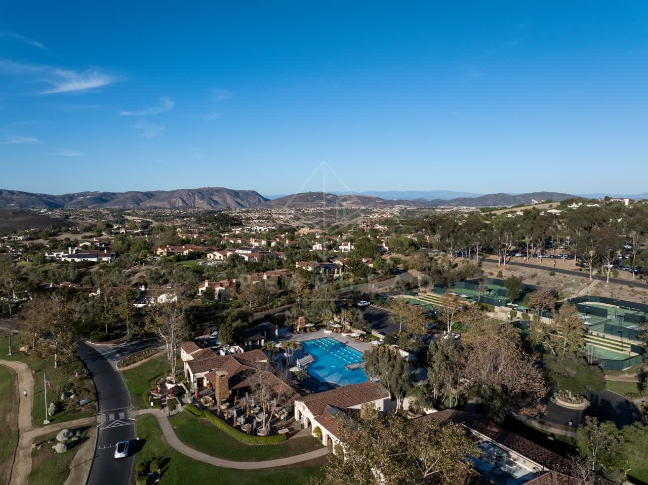 Aerial view of a residential street, homes and the buildings in Santaluz.