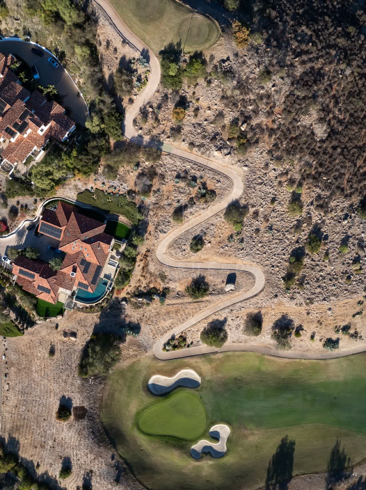 Aerial view of a residential street, homes and the buildings in Santaluz.