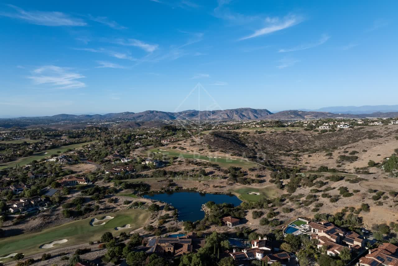 Aerial view of the country inland, homes and open country in Santaluz.