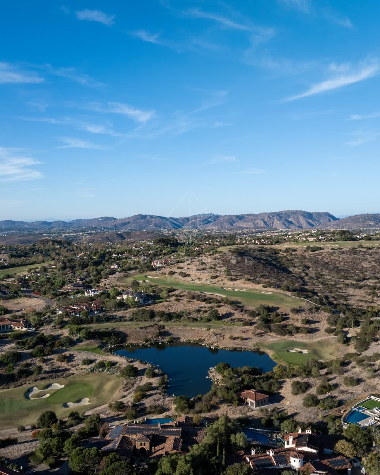 Aerial view of the country inland, homes and the buildings in Santaluz.