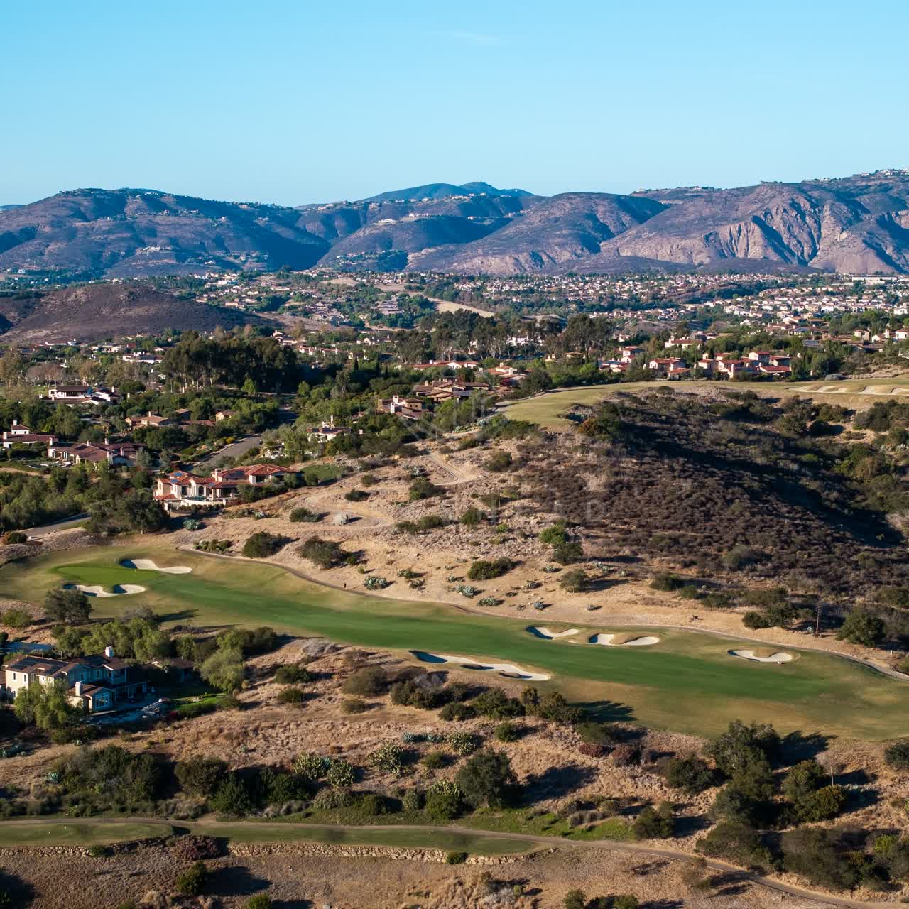 Aerial view of the country inland, homes and the buildings in Santaluz.