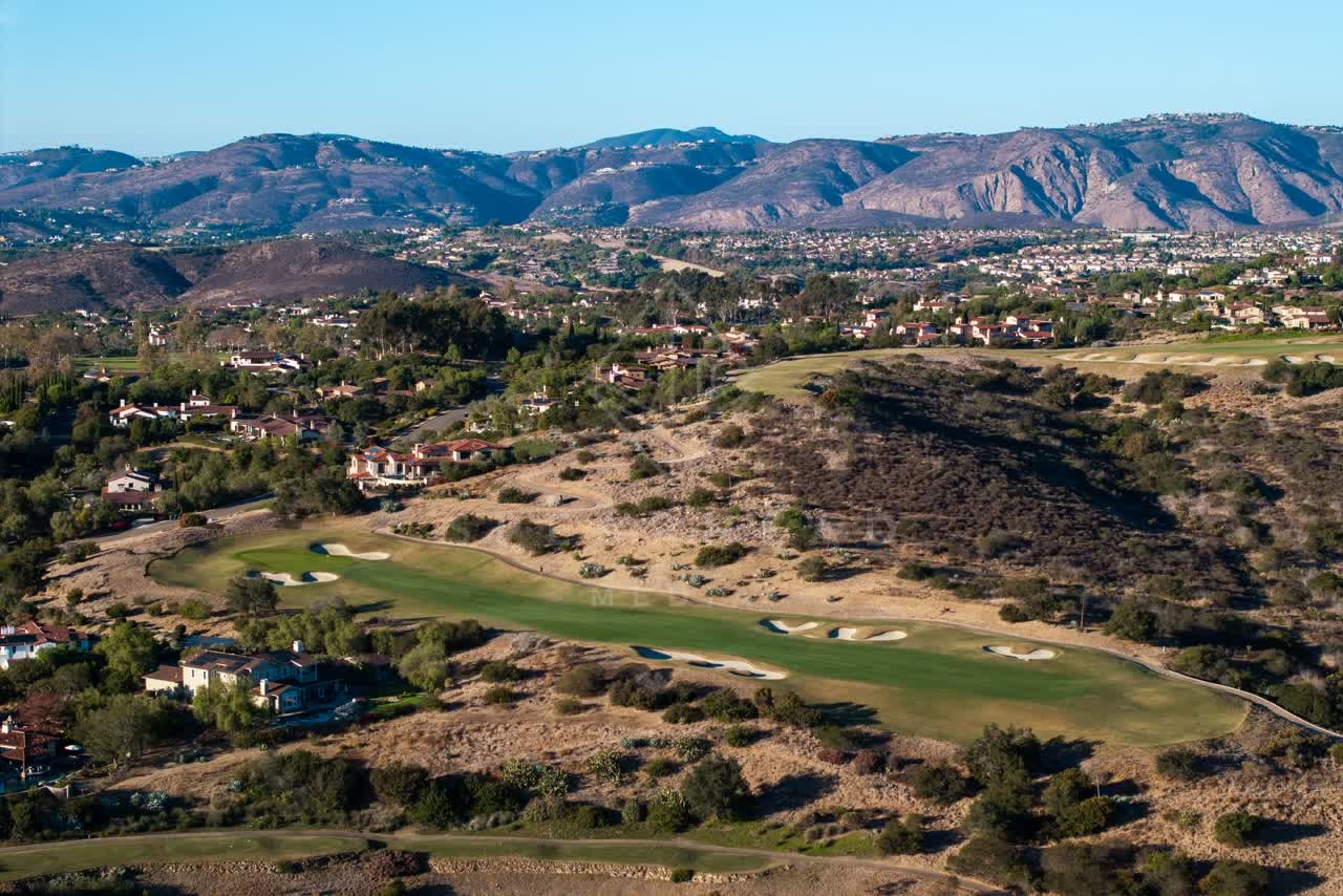 Aerial view of the country inland, homes and the buildings in Santaluz.