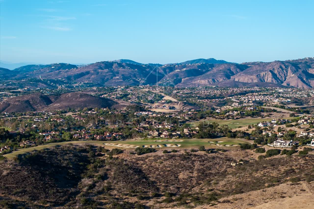 Aerial view of the country inland, homes and open country in Santaluz.