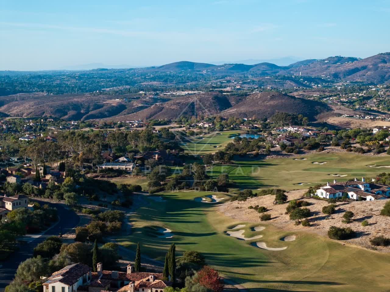 Aerial view of the country inland, homes and the buildings in Santaluz.
