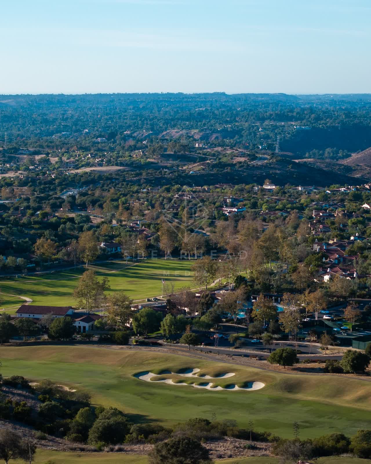 Aerial view of the country inland, homes and traffic in Santaluz.