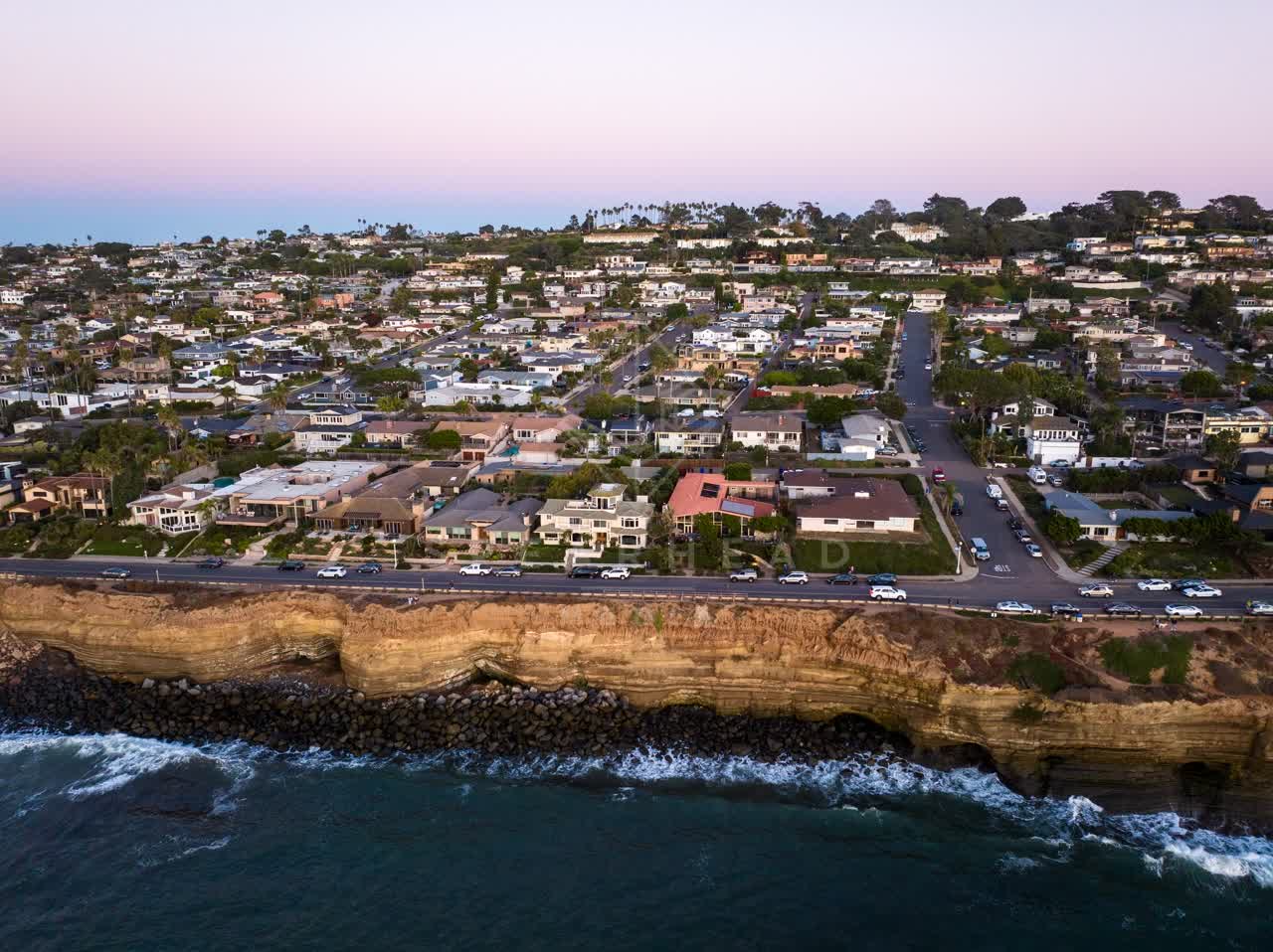 Aerial view of the cliffs, the ocean and homes at Sunset Cliffs.