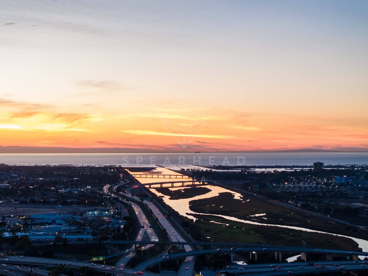 Aerial view of the country inland, the bridge and the ocean in Mission Bay.