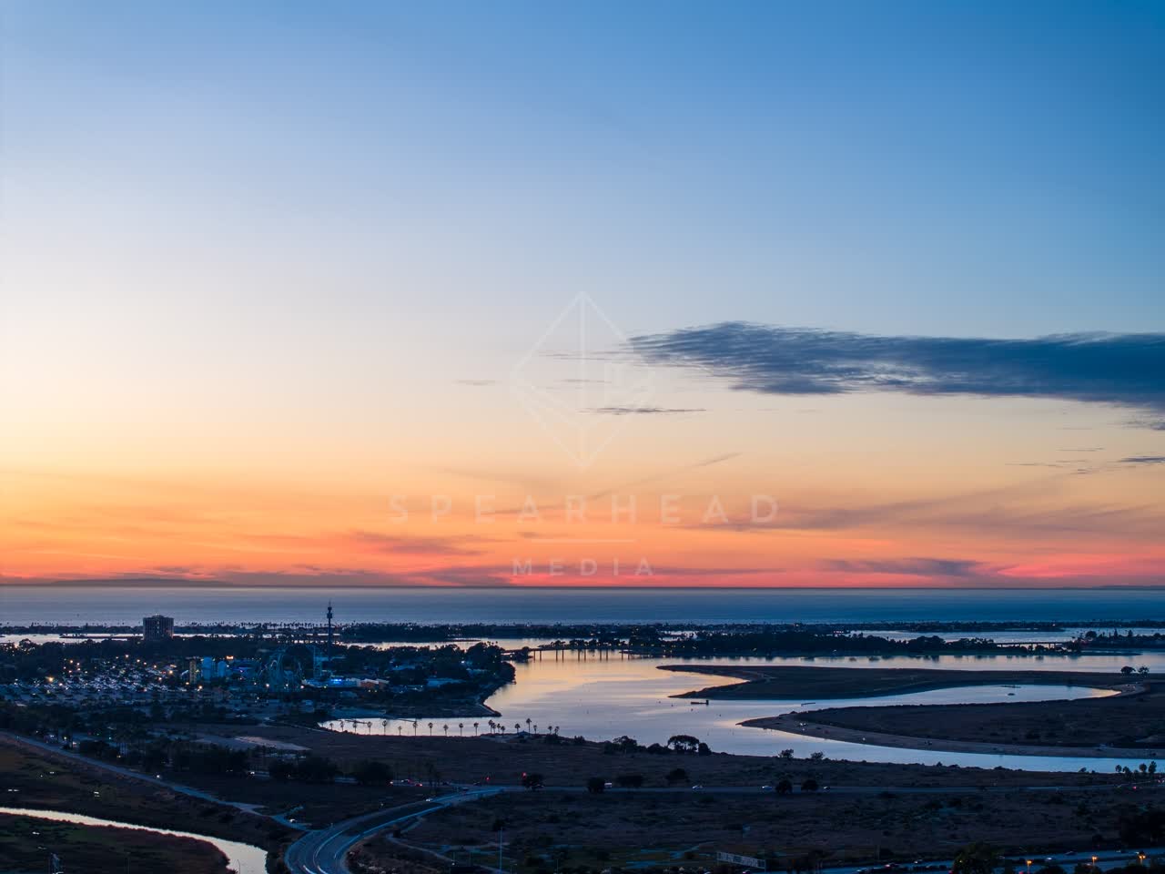 Aerial view of the country inland, the bay and traffic in Mission Bay.