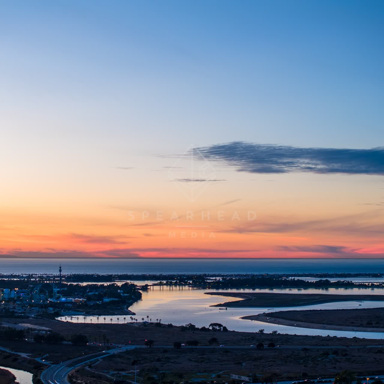 Aerial view of the country inland, the bay and traffic in Mission Bay.