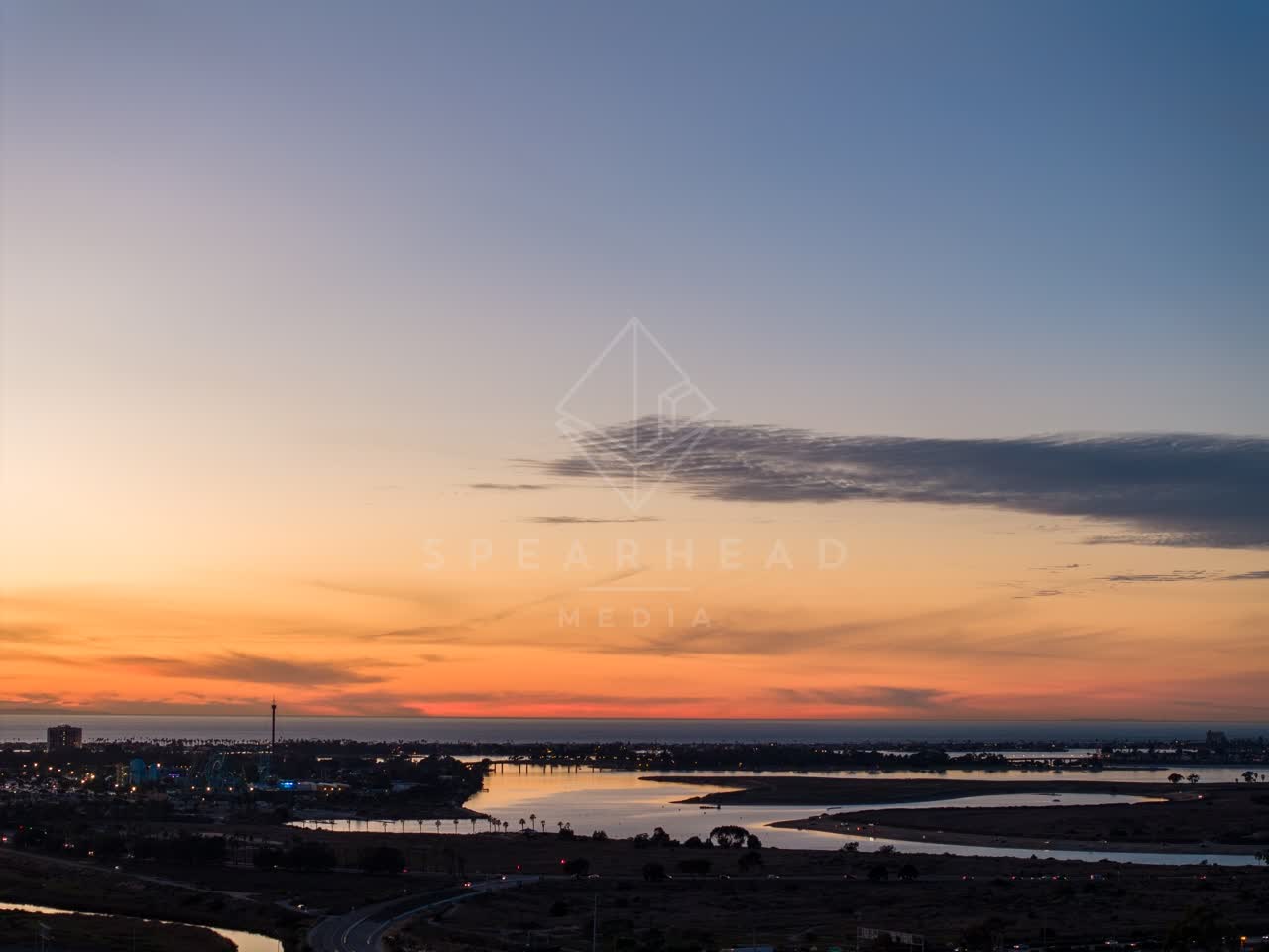 Aerial view of the country inland, the bay and homes in Mission Bay.