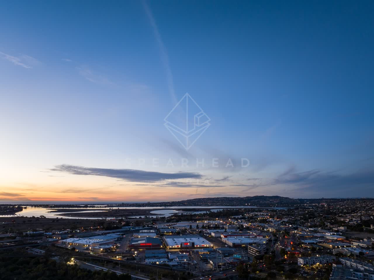 Aerial view of the country inland, the bay and homes in Mission Bay.