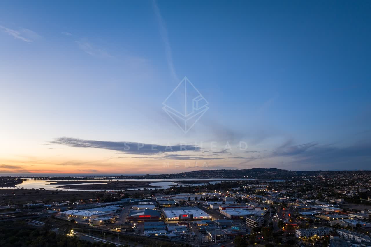 Aerial view of the country inland, the bay and homes in Mission Bay.