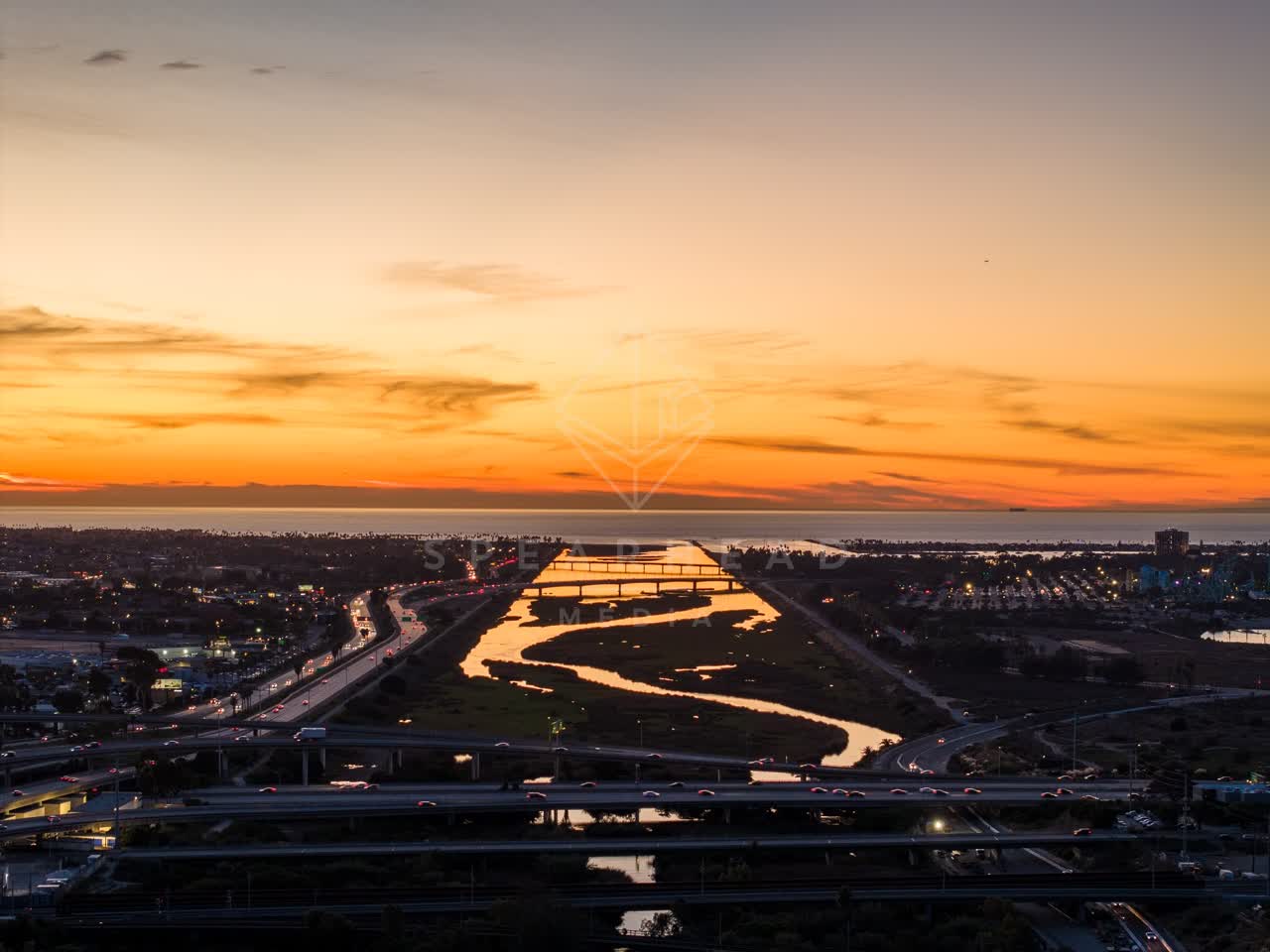 Aerial view of the country inland, the bridge and the ocean in Mission Bay.