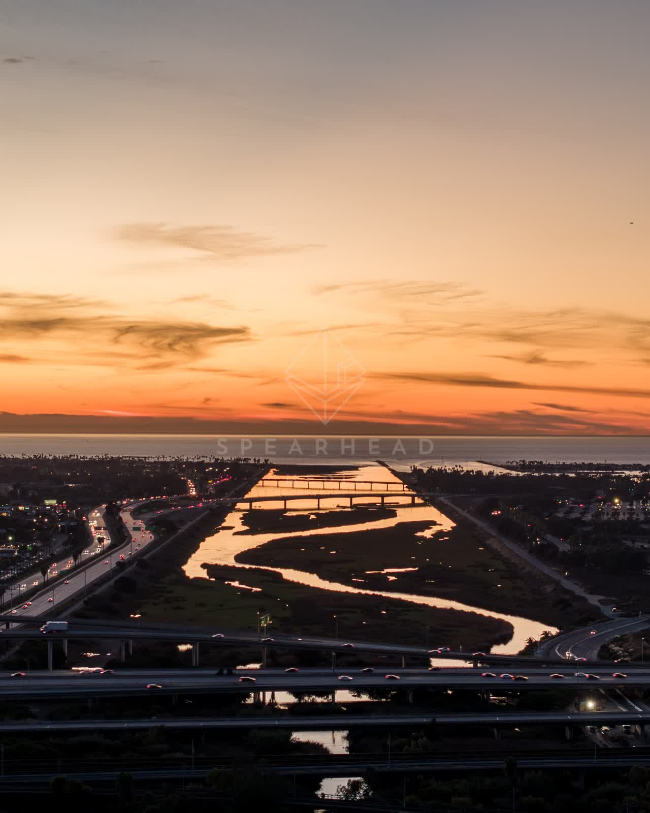 Aerial view of the country inland, the bridge and traffic in Mission Bay.