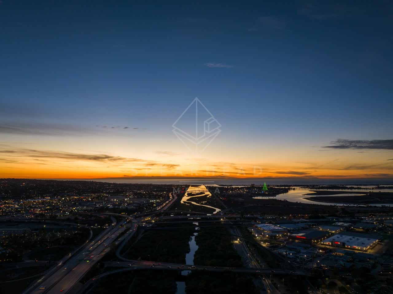 Aerial view of the country inland, the bay and traffic in Mission Bay.