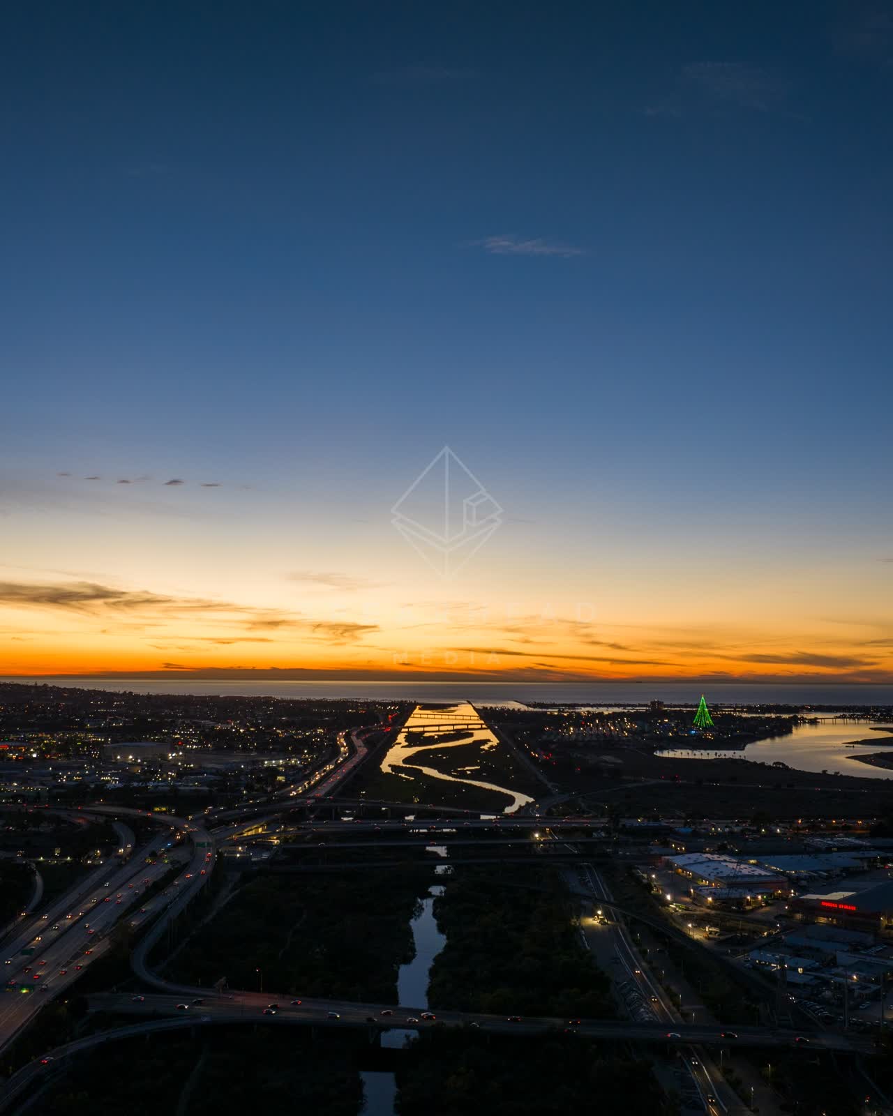 Aerial view of the country inland, the bay and homes in Mission Bay.