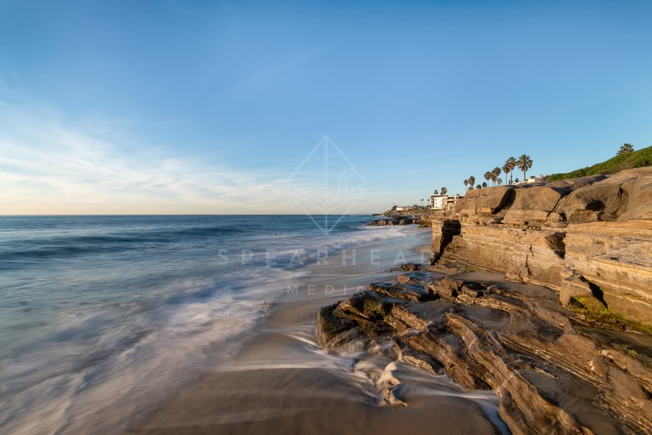 The cliffs, palm trees and the ocean at Windansea.