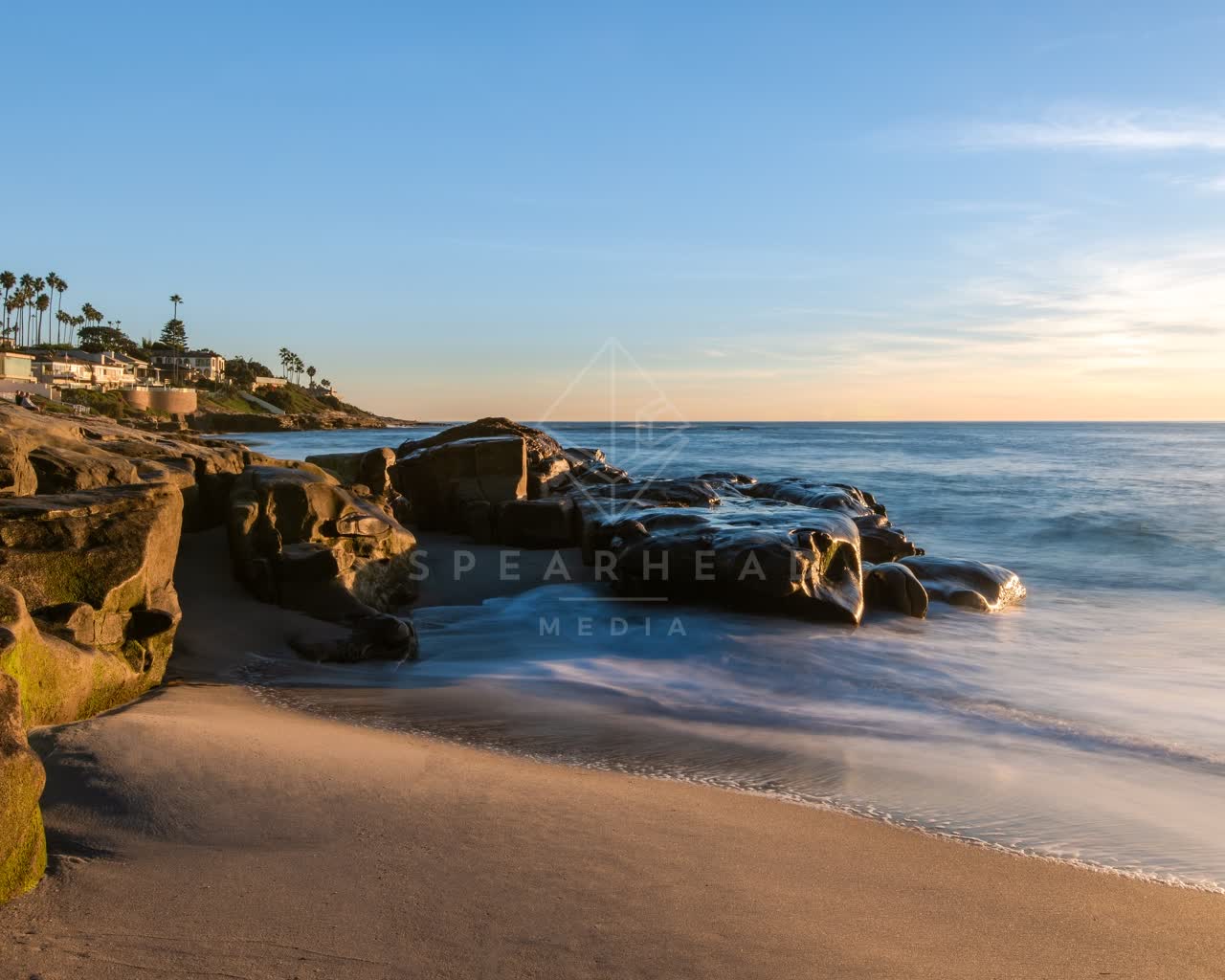 The beach, the surf and palm trees at Windansea.