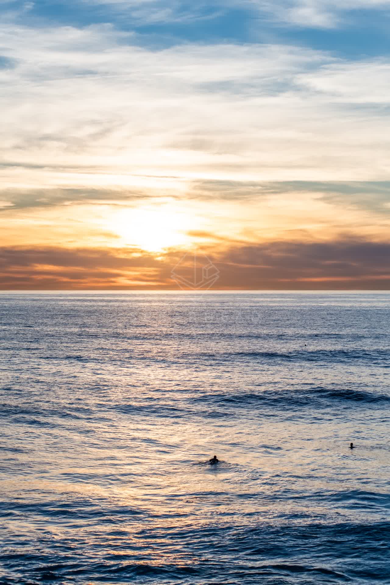 The beach, the surf and the ocean at Windansea, with swimmers in the water.
