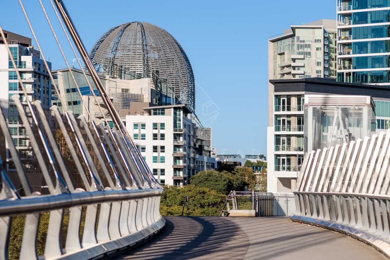 Elevated view of the downtown streets, the bridge and the skyline at East Village.