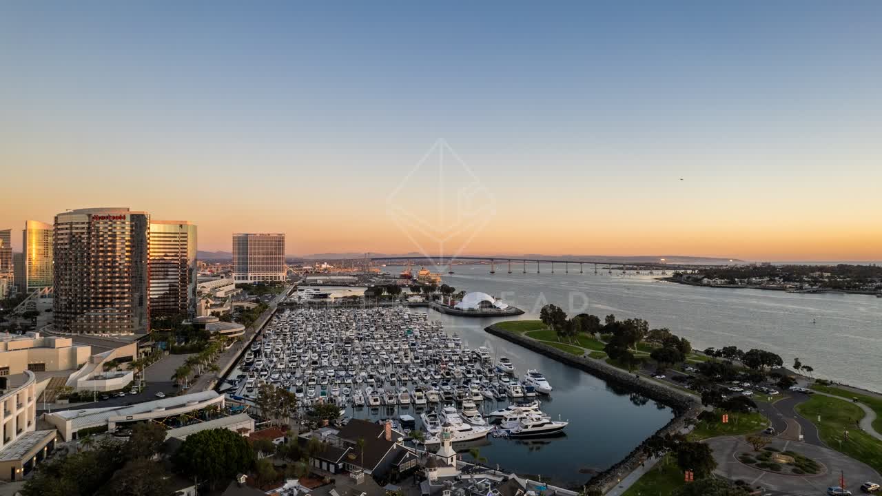 Aerial view of the harbor, the bridge and the skyline at San Diego Marina, with boats out.