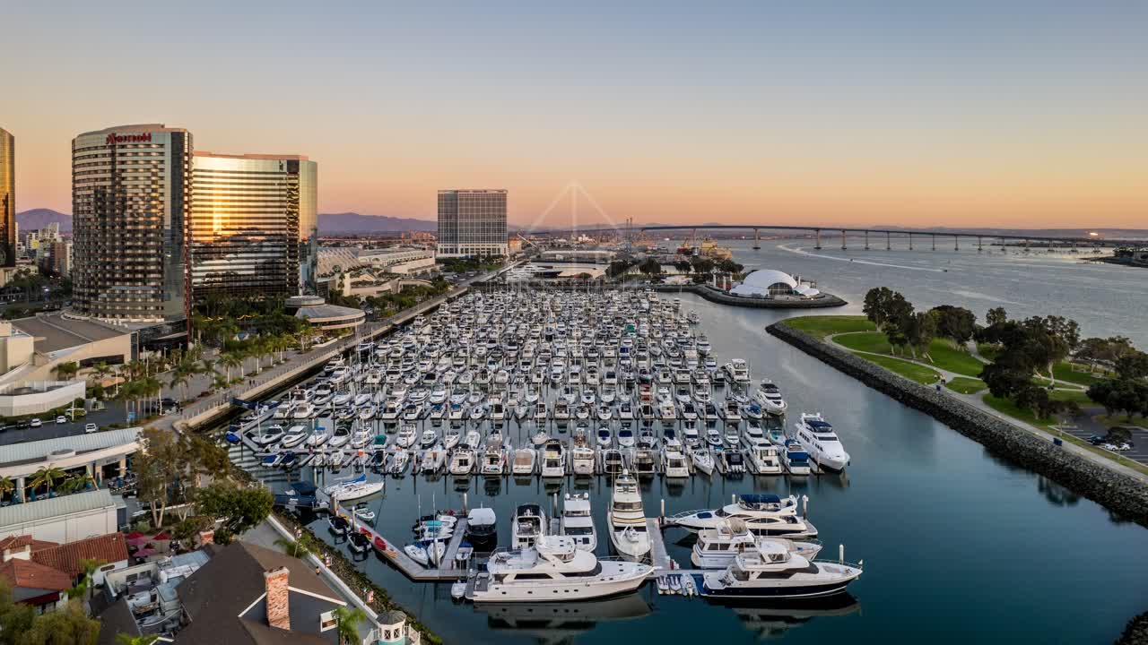 Aerial view of the harbor, the bridge and the skyline at San Diego Marina, with boats out.