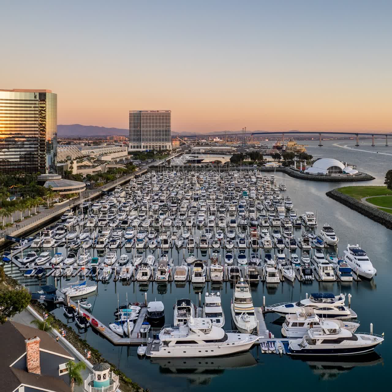 Aerial view of the harbor, the bridge and the skyline at San Diego Marina, with boats out.