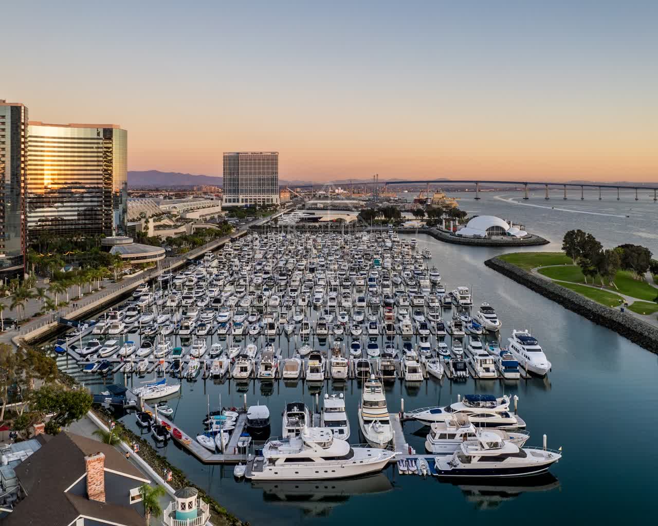 Aerial view of the harbor, the bridge and the skyline at San Diego Marina, with boats out.