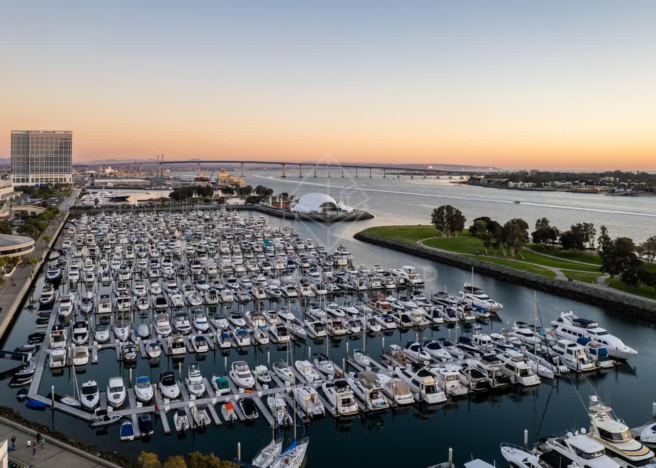Aerial view of the harbor, the bridge and boats at San Diego Marina, with boats out.