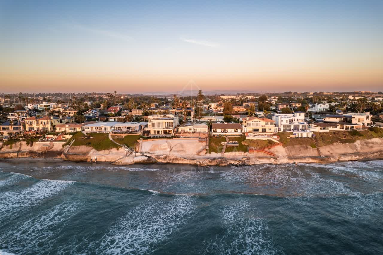 Aerial view of the cliffs, the surf and the ocean at Terramar Beach.