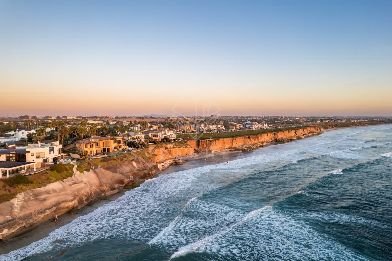 Aerial view of the cliffs, the surf and the ocean at Terramar Beach.