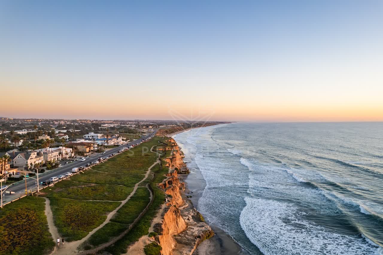 Aerial view of the cliffs, the surf and the ocean at Terramar Beach.