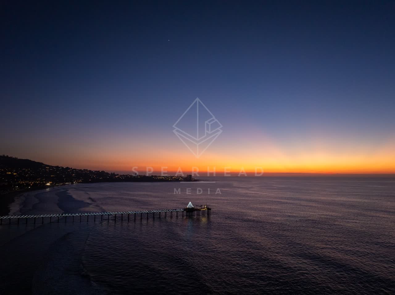 Aerial view of the beach, the pier and the ocean at La Jolla Shores.