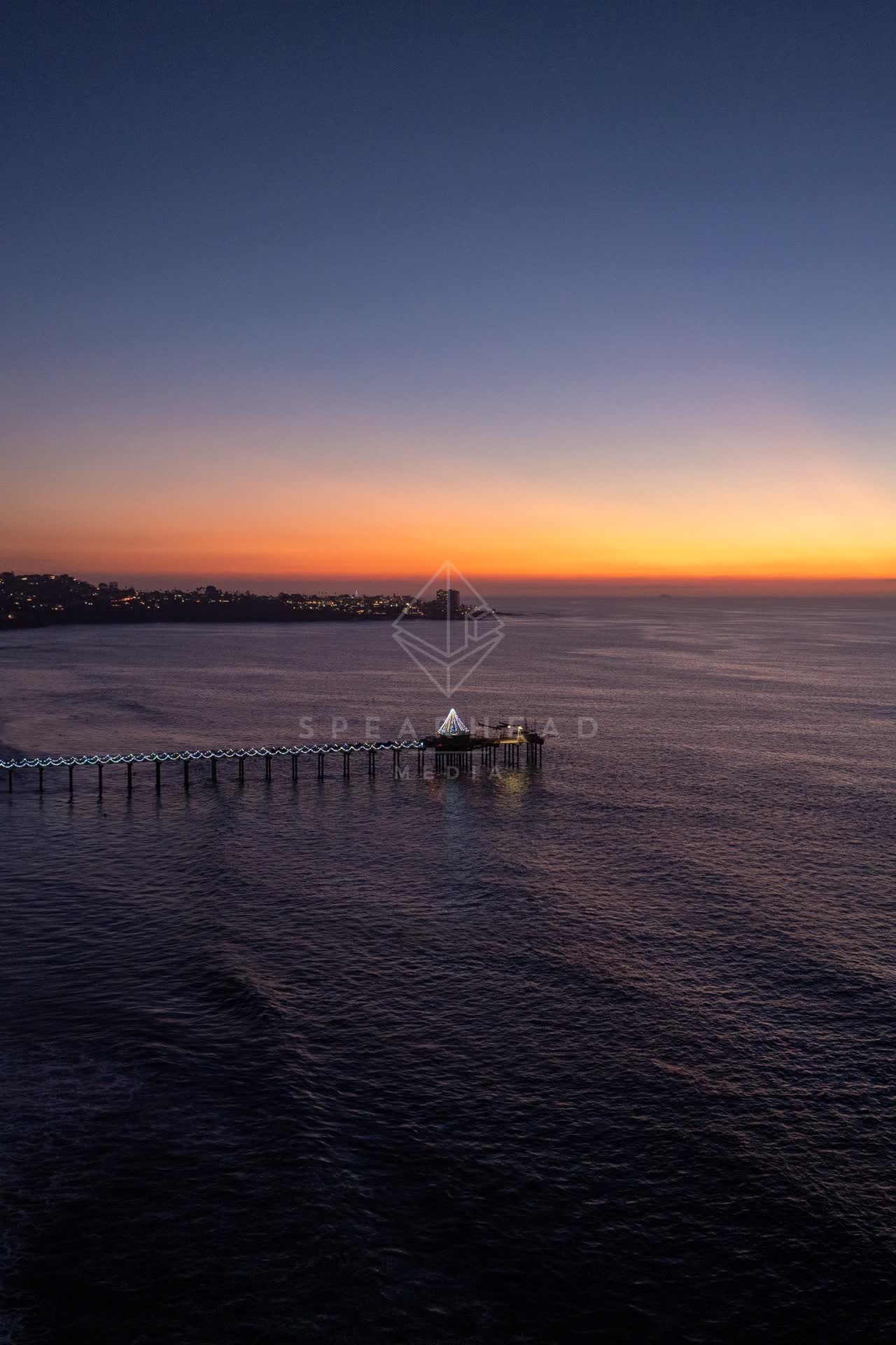 Aerial view of the beach, the pier and the ocean at La Jolla Shores.