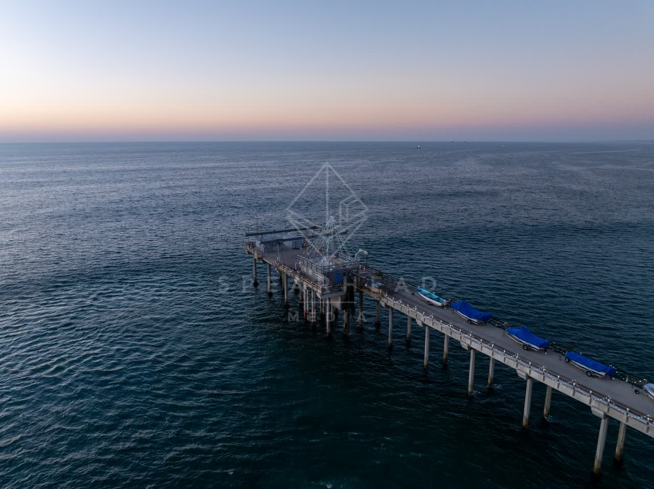 Aerial view of the beach, the pier and the ocean at La Jolla Shores.
